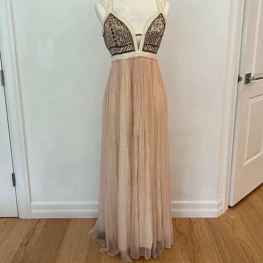 maxi dress with slit in front, sequins throughout the dress making it sparkle!